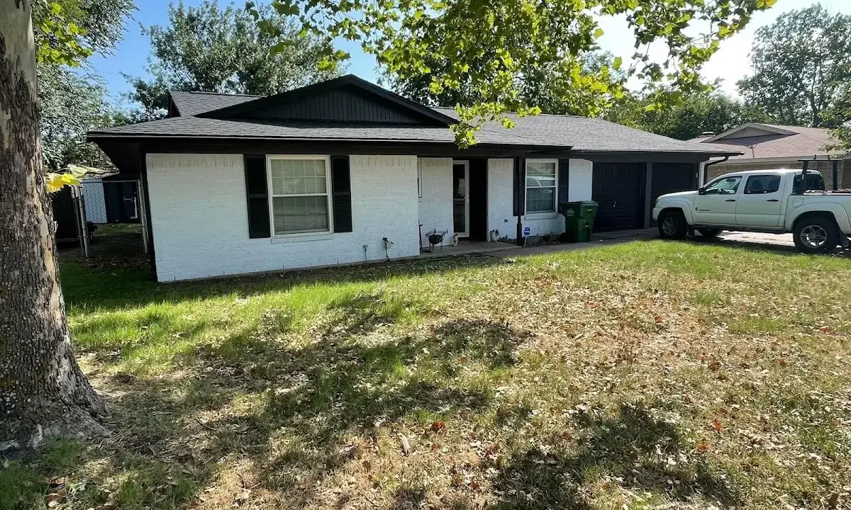Professional roofing crew working on a residential roof in Hannibal